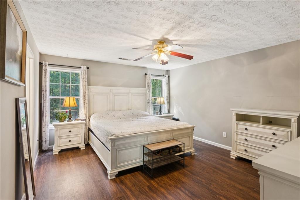 115 Alcovy Circle Covington, GA 30014 - Photo 13 of 27 a bedroom with a bed and a dresser