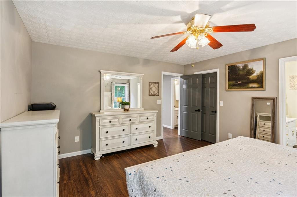 115 Alcovy Circle Covington, GA 30014 - Photo 15 of 27 a bedroom with a bed and a dresser