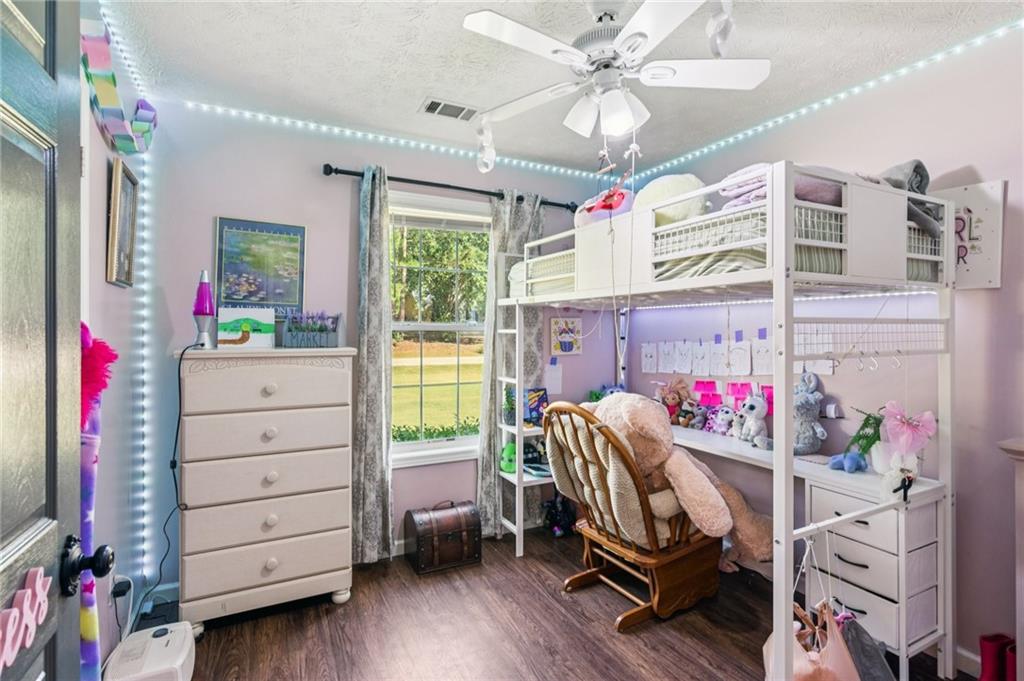 115 Alcovy Circle Covington, GA 30014 - Photo 19 of 27 a view of a workspace with furniture and a window
