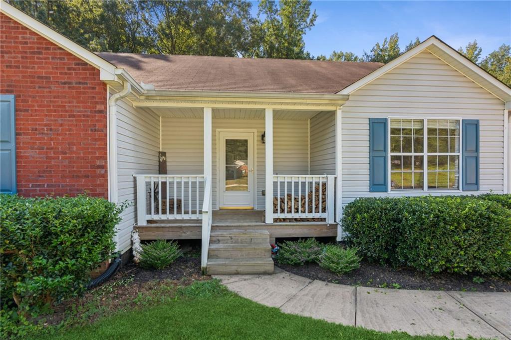 115 Alcovy Circle Covington, GA 30014 - Photo 2 of 27 a front view of a house with a yard