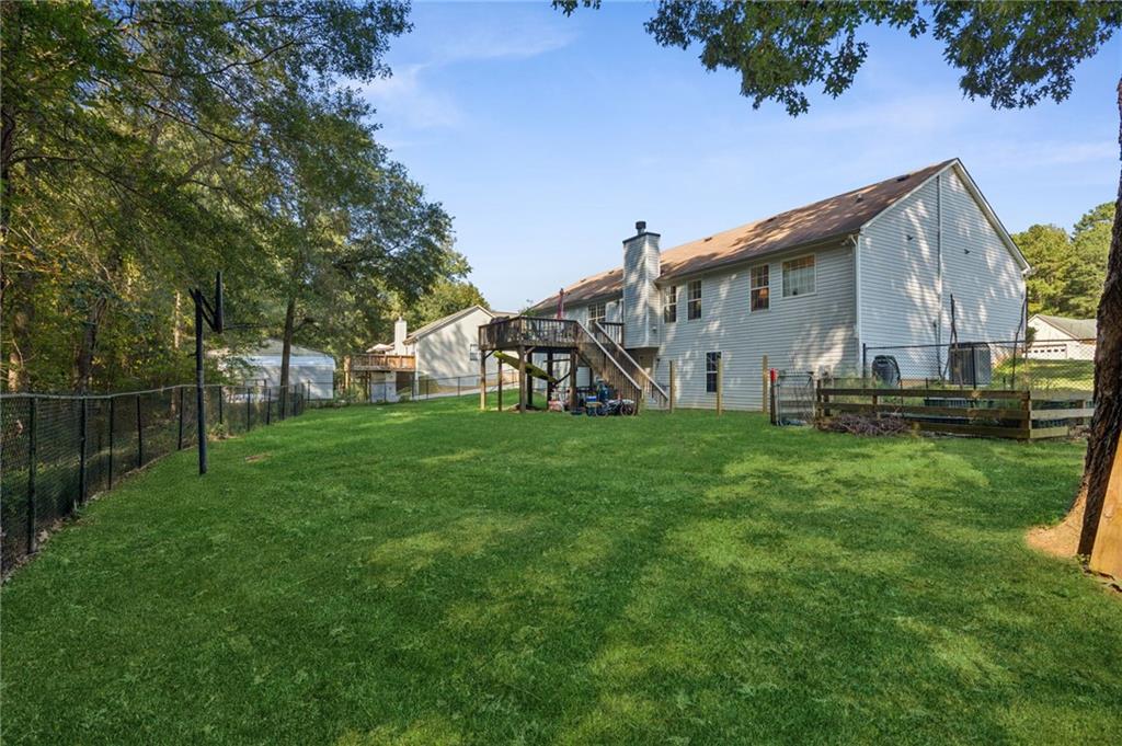 115 Alcovy Circle Covington, GA 30014 - Photo 24 of 27 a view of a house with backyard and garden