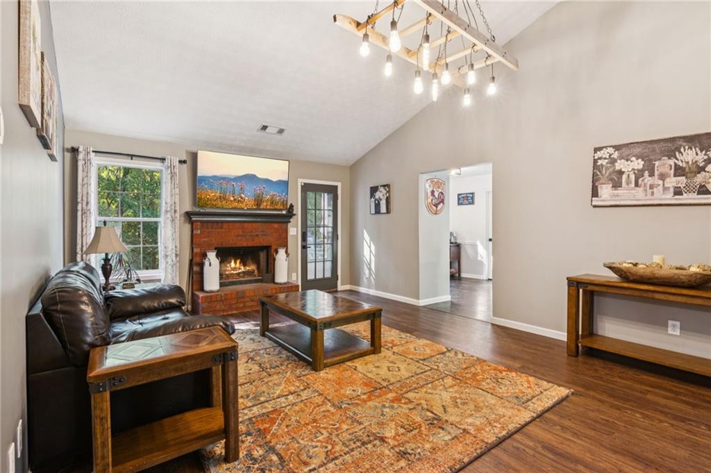 115 Alcovy Circle Covington, GA 30014 - Photo 5 of 27 a living room with furniture and a fireplace