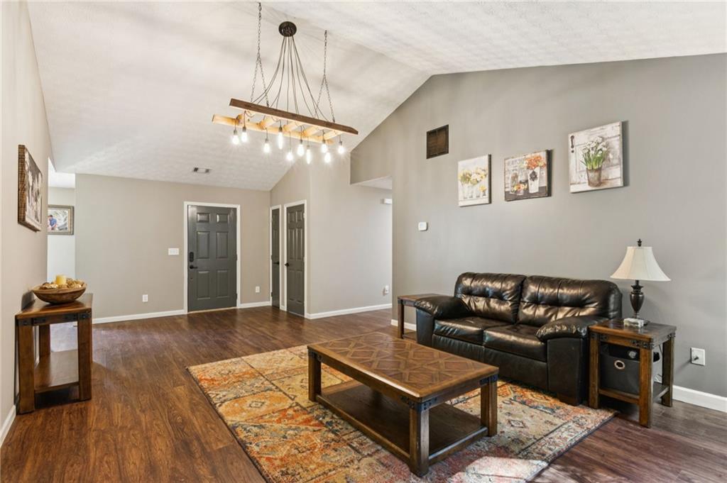 115 Alcovy Circle Covington, GA 30014 - Photo 6 of 27 a living room with furniture and wooden floor