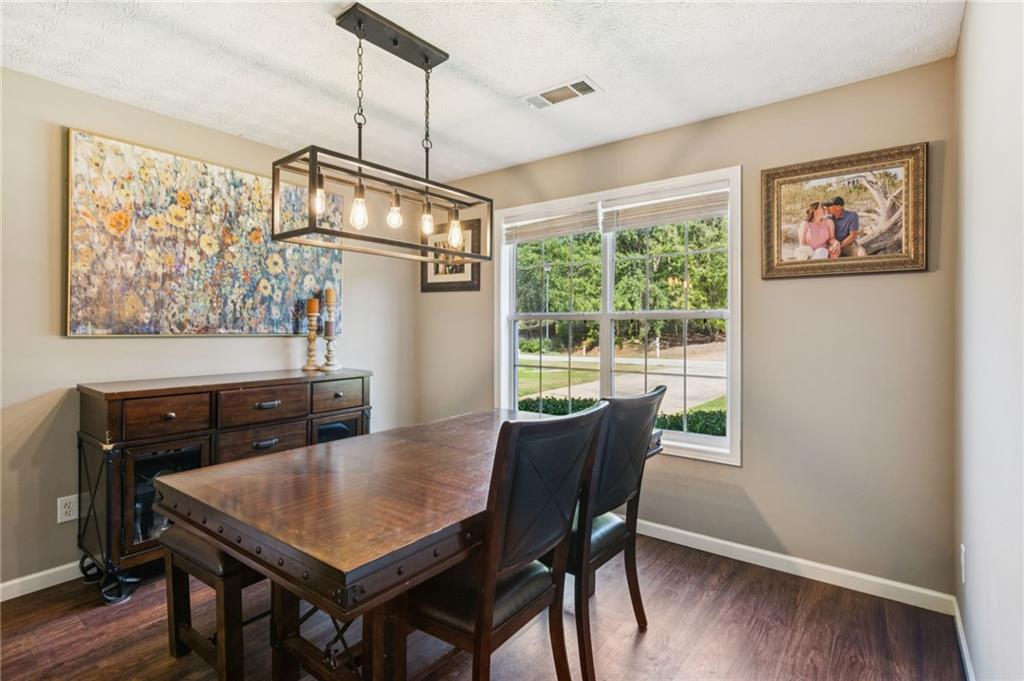 115 Alcovy Circle Covington, GA 30014 - Photo 7 of 27 a view of a dining room with furniture window and wooden floor