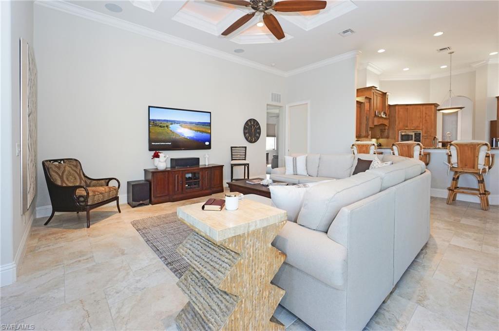 7316 Hagen Way Naples, FL 34113 - Photo 27 of 48 a living room with furniture and a flat screen tv