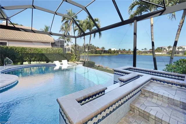 a view of a swimming pool with a lake