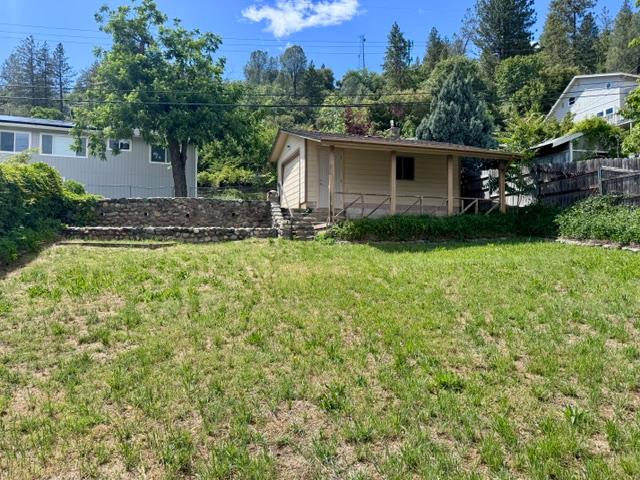 240 Pleasant Street Colfax, CA 95713 - Photo 20 of 26 a view of backyard with a garden and trees