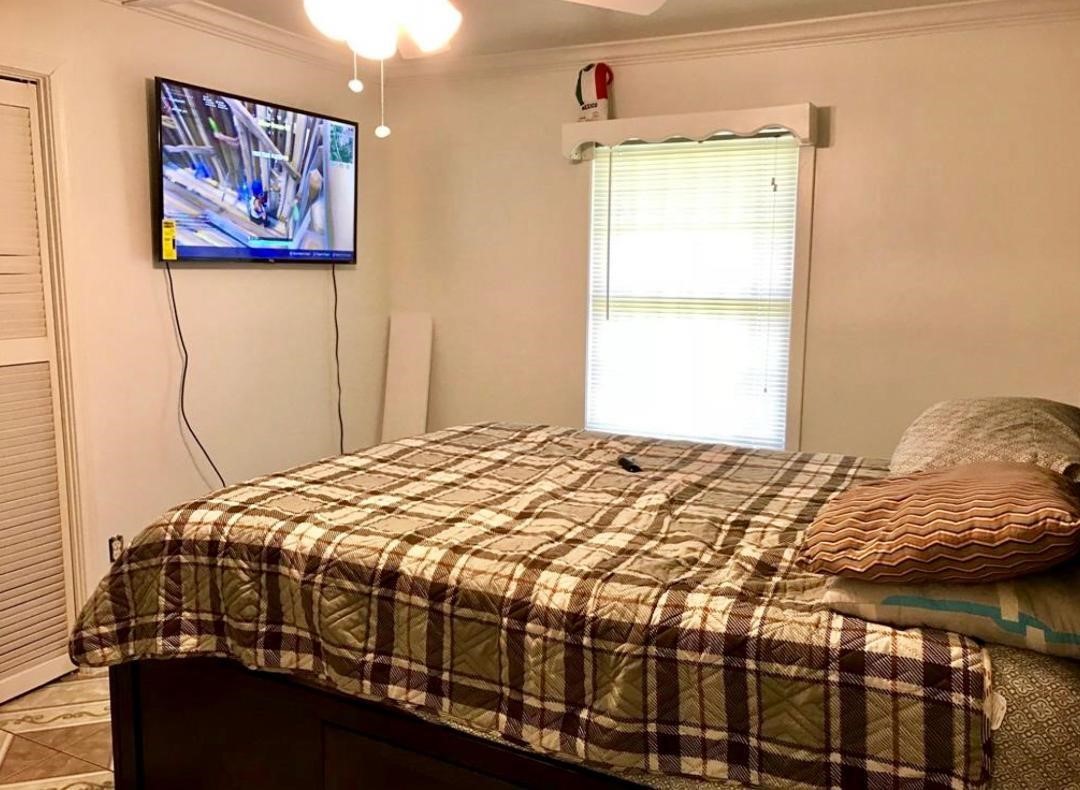 2230 Gault Road Houston, TX 77039 - Photo 13 of 30 a bedroom with a bed and a window