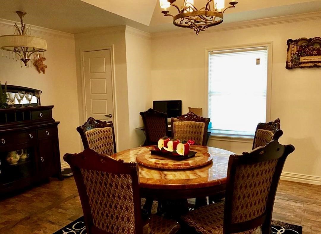 2230 Gault Road Houston, TX 77039 - Photo 19 of 30 a dining room with furniture and chandelier