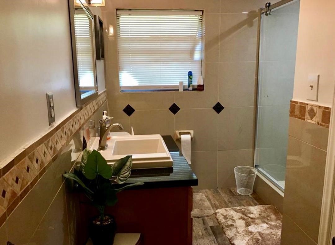 2230 Gault Road Houston, TX 77039 - Photo 24 of 30 a bathroom with a sink a toilet and mirror