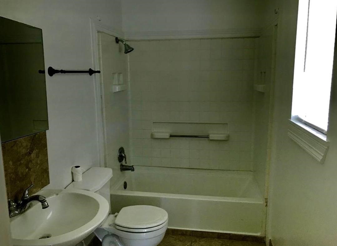 2230 Gault Road Houston, TX 77039 - Photo 30 of 30 a bathroom with a toilet a sink and shower