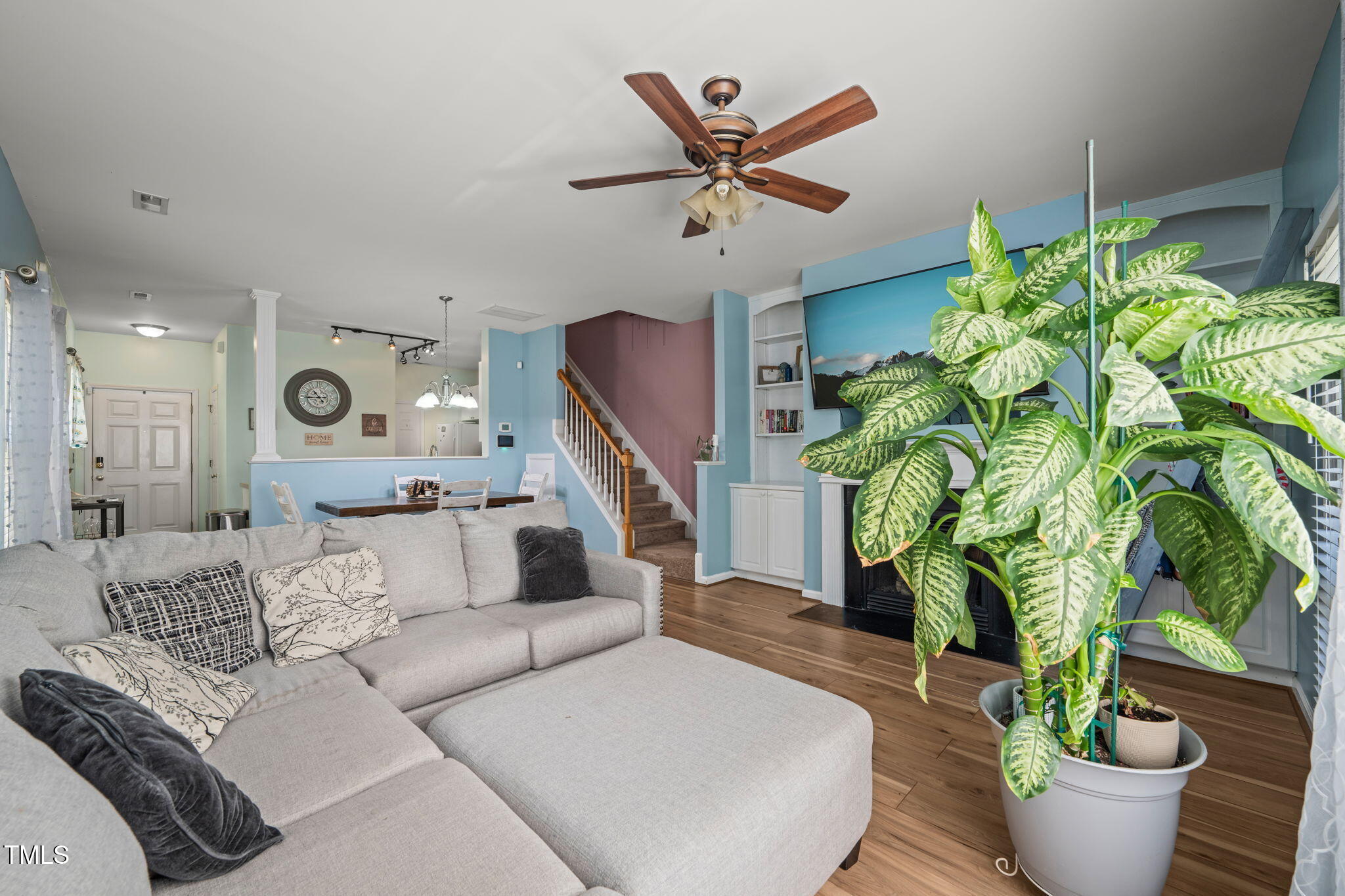 2105 Metacomet Way Raleigh, NC 27604 - Photo 13 of 43 a living room with furniture and a potted plant