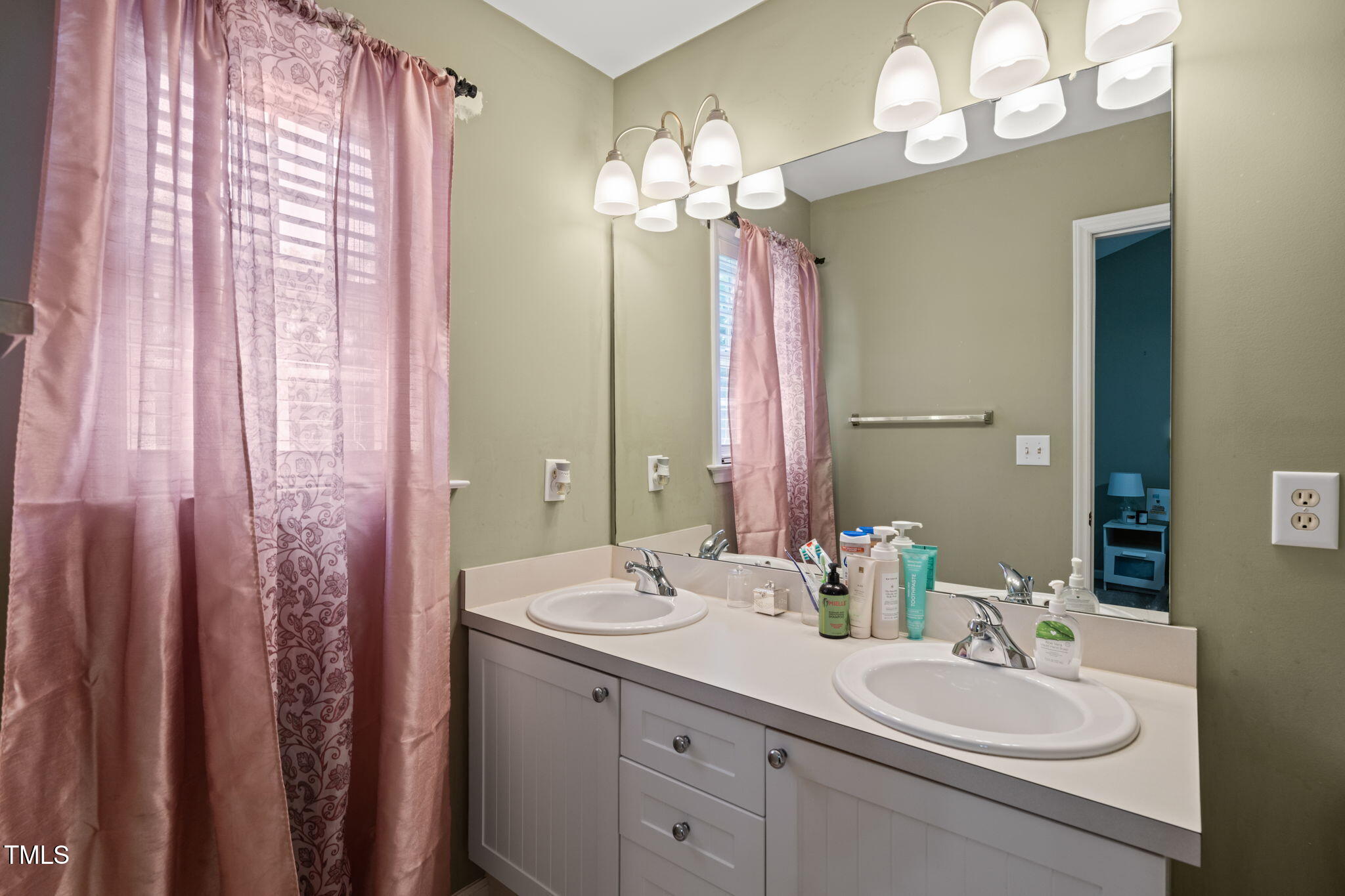 2105 Metacomet Way Raleigh, NC 27604 - Photo 17 of 43 a bathroom with a double vanity sink mirror and double
