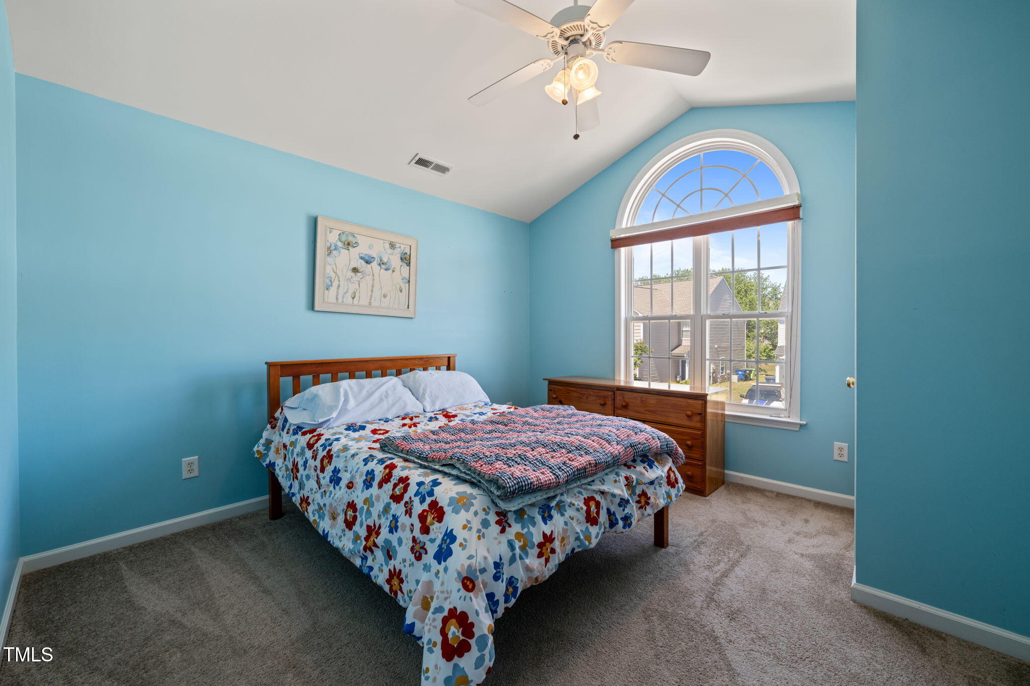 2105 Metacomet Way Raleigh, NC 27604 - Photo 19 of 43 a bedroom with a bed and a chandelier
