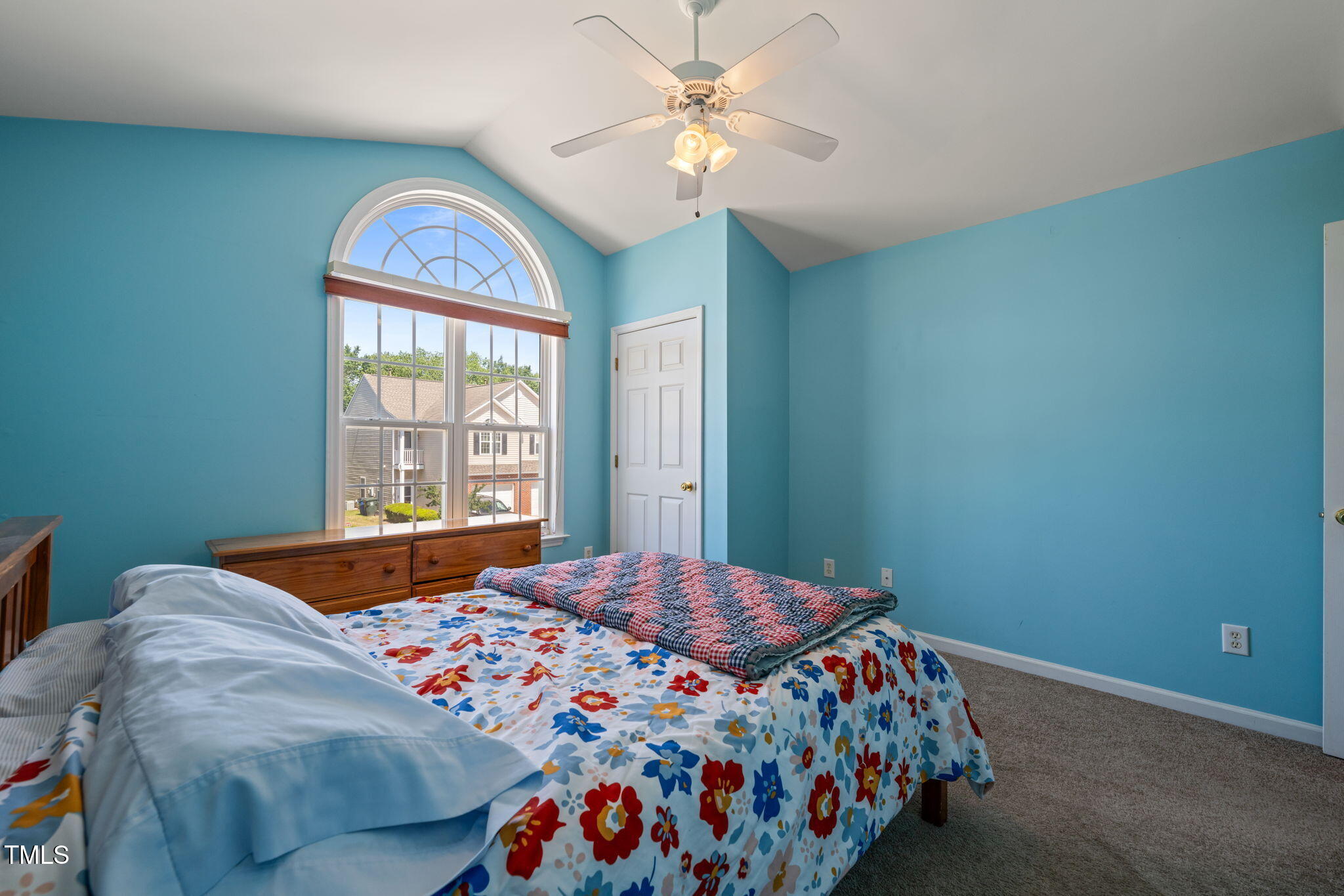 2105 Metacomet Way Raleigh, NC 27604 - Photo 20 of 43 a bedroom with a bed and a chandelier