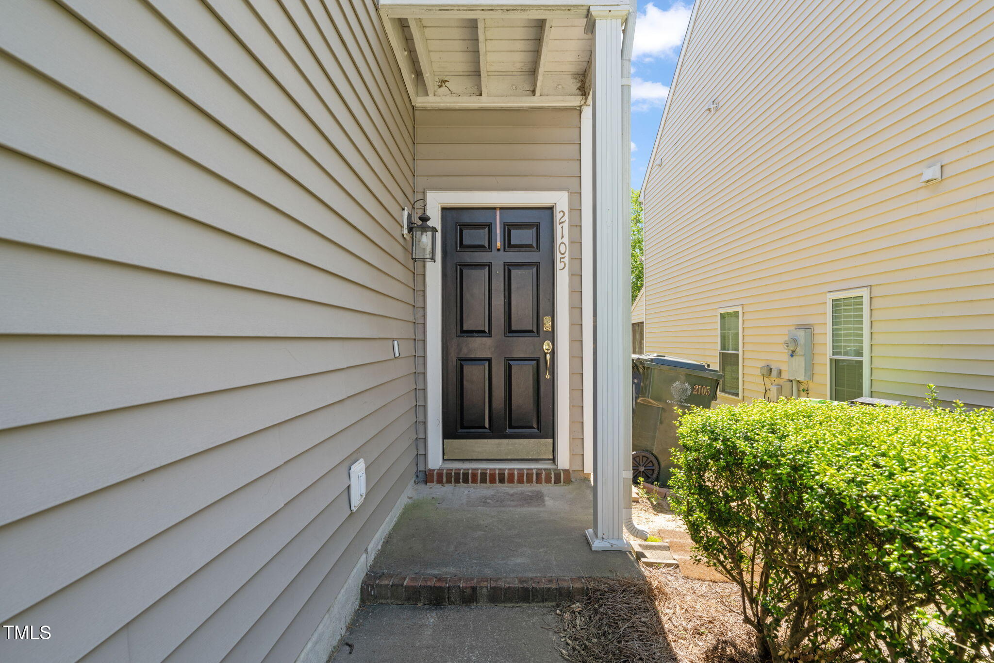 2105 Metacomet Way Raleigh, NC 27604 - Photo 2 of 43 a view of a house with a door and wooden walls