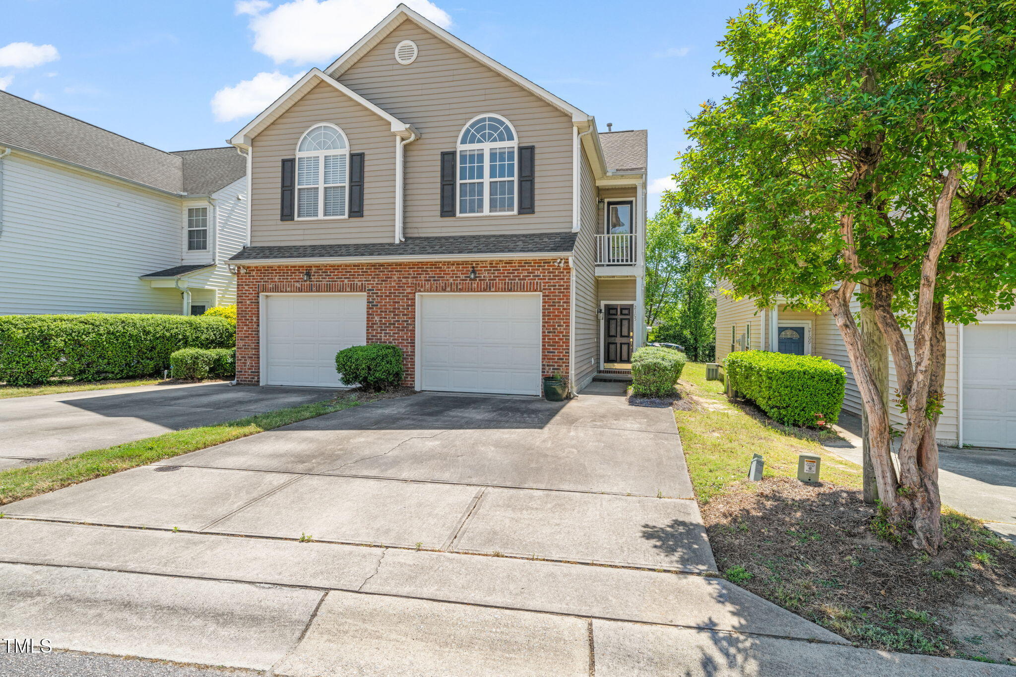 2105 Metacomet Way Raleigh, NC 27604 - Photo 29 of 43 a front view of a house with a yard and garage