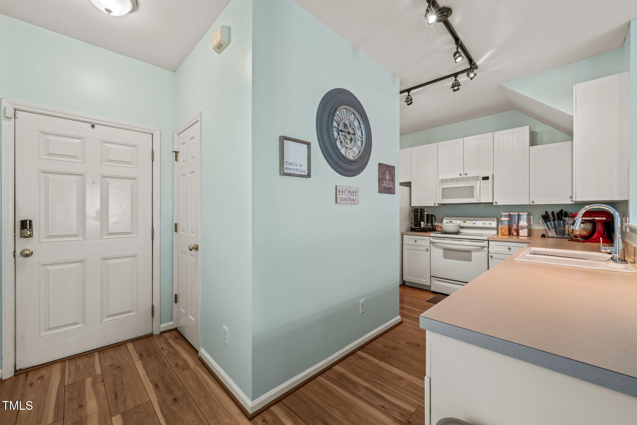 2105 Metacomet Way Raleigh, NC 27604 - Photo 3 of 43 a kitchen with a refrigerator and a stove top oven