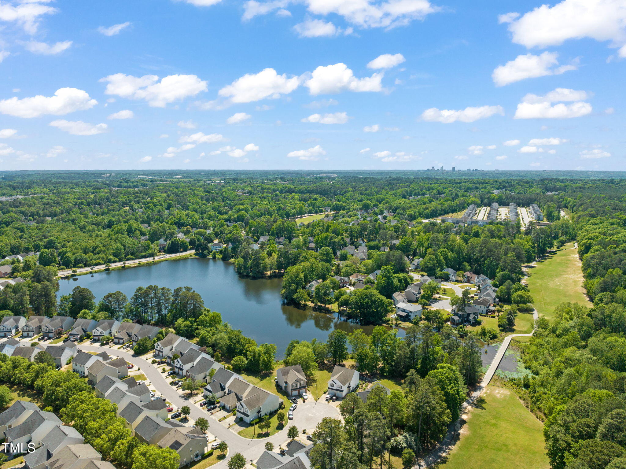 2105 Metacomet Way Raleigh, NC 27604 - Photo 31 of 43 a view of a lake with a city