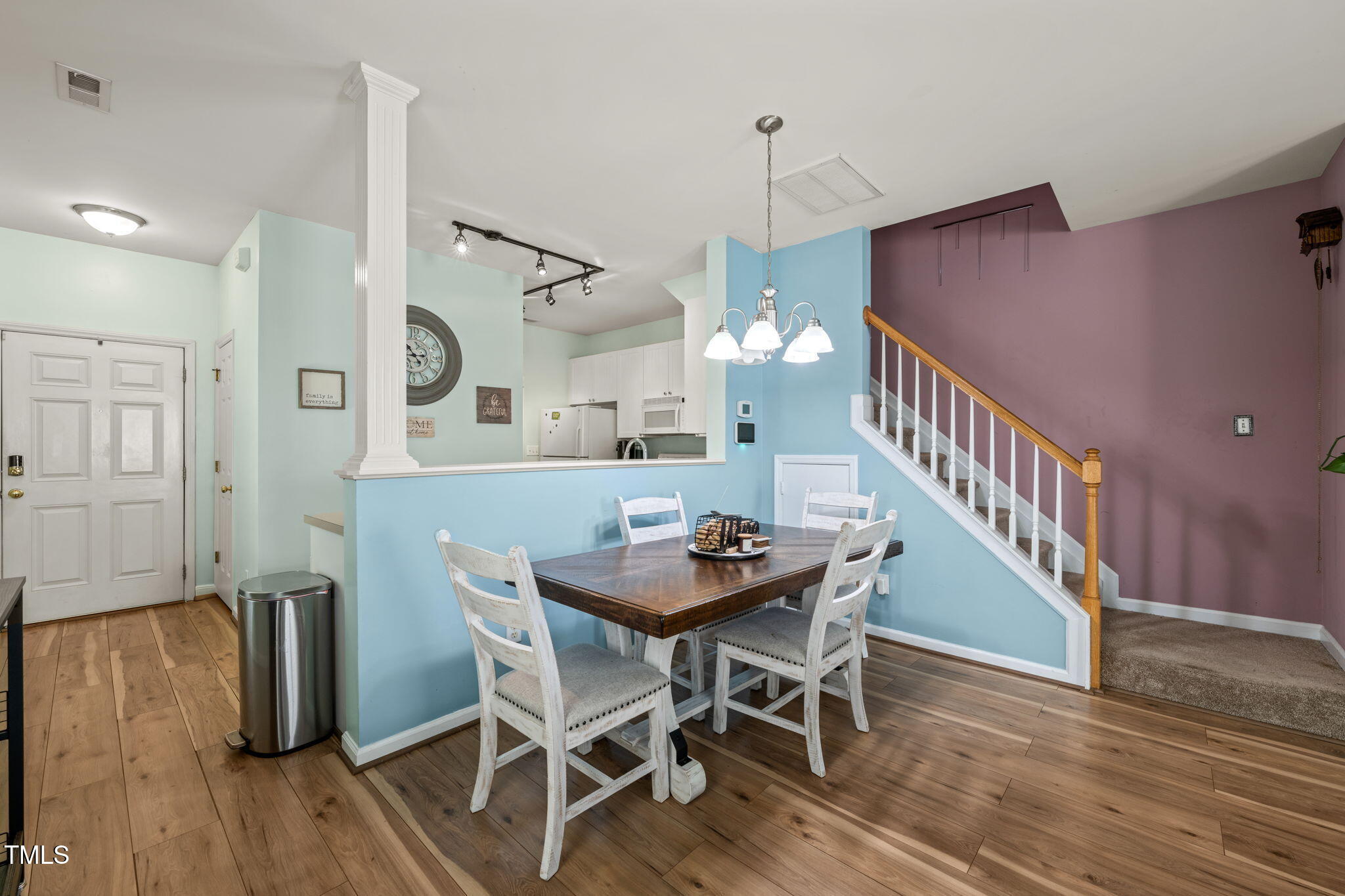 2105 Metacomet Way Raleigh, NC 27604 - Photo 7 of 43 a view of a dining room with furniture and wooden floor