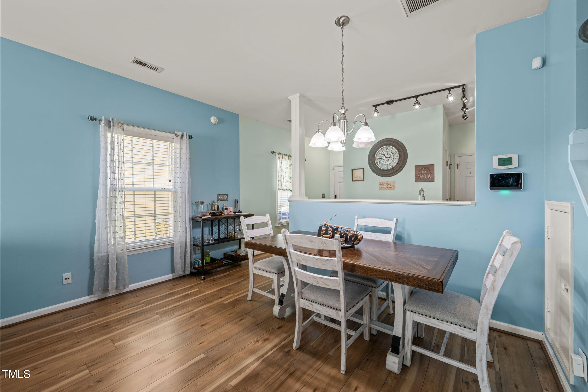 2105 Metacomet Way Raleigh, NC 27604 - Photo 10 of 43 a view of a dining room that has a table and chairs in it