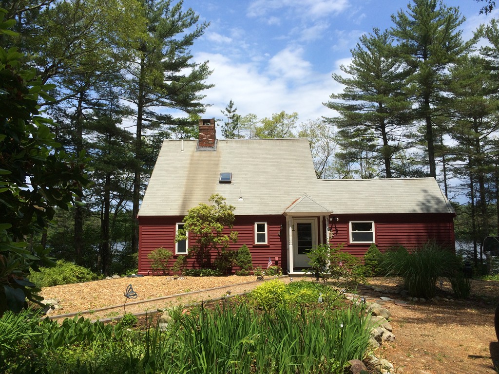 80 Snows Pond Road Rochester, MA 02770 - Photo 1 of 11 a view of a house with a yard and potted plants