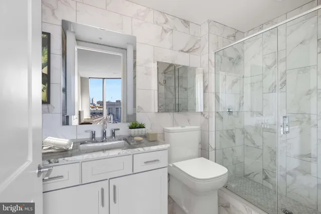 a bathroom with a sink a toilet and bathtub