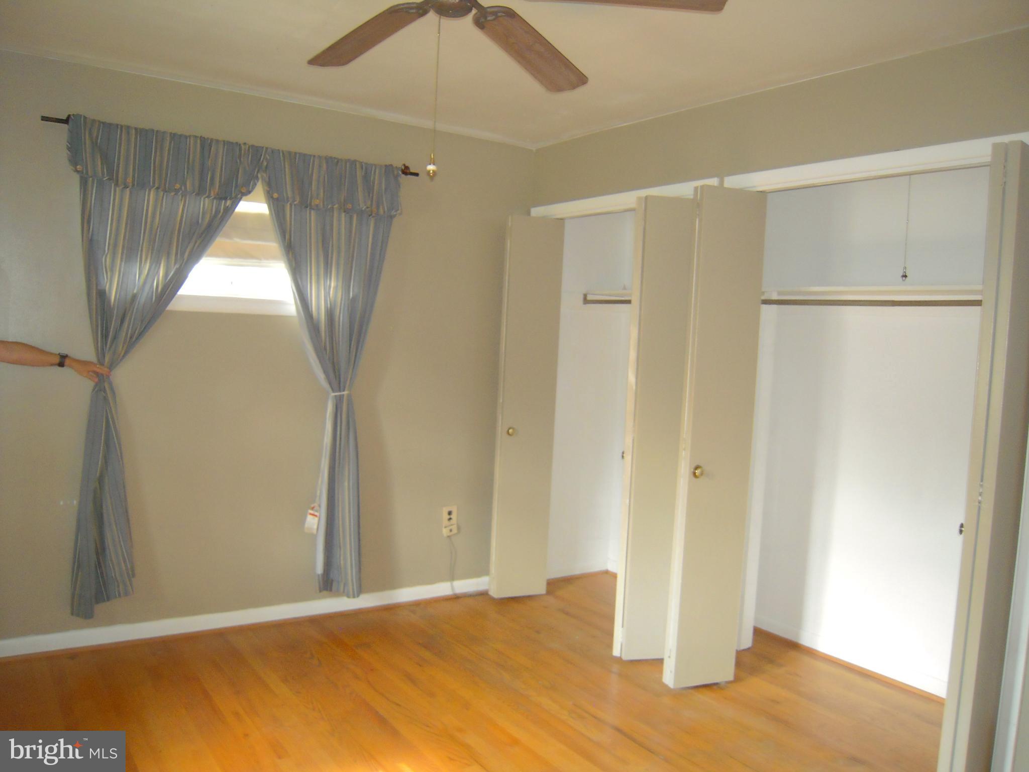 13009 Claxton Drive Laurel, MD 20708 - Photo 14 of 31 Master bedroom w/ceiling fan & hardwd floors