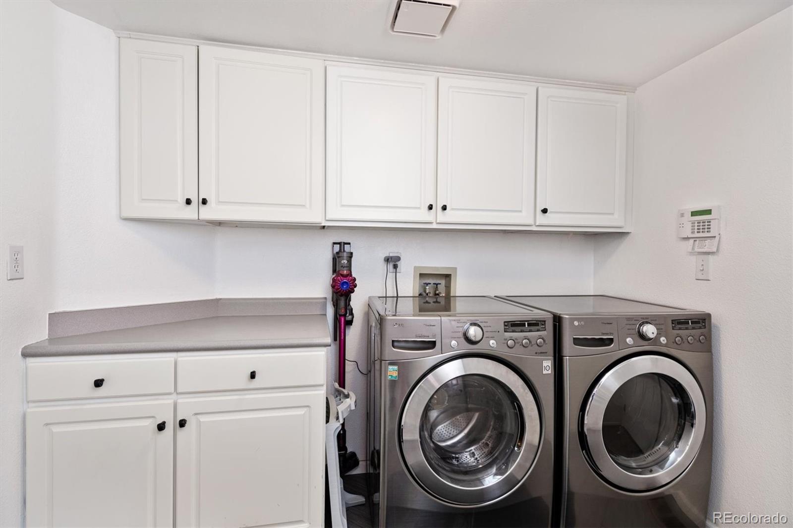 9812 South Spring Hill Place Highlands Ranch, CO 80129 - Photo 14 of 27 a utility room with dryer and washer