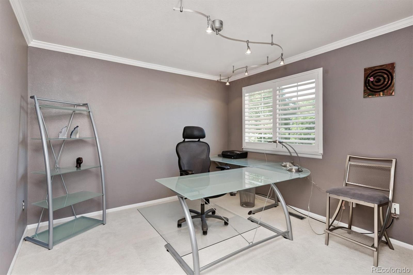 9812 South Spring Hill Place Highlands Ranch, CO 80129 - Photo 22 of 27 a workspace with furniture and a window