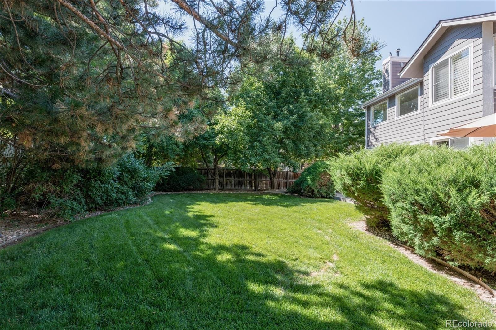 9812 South Spring Hill Place Highlands Ranch, CO 80129 - Photo 26 of 27 a view of a backyard with a garden