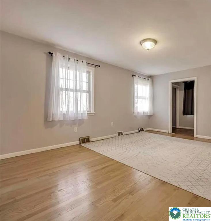 2324 Kemmerer Street Bethlehem, PA 18017 - Photo 15 of 26 an empty room with wooden floor and windows