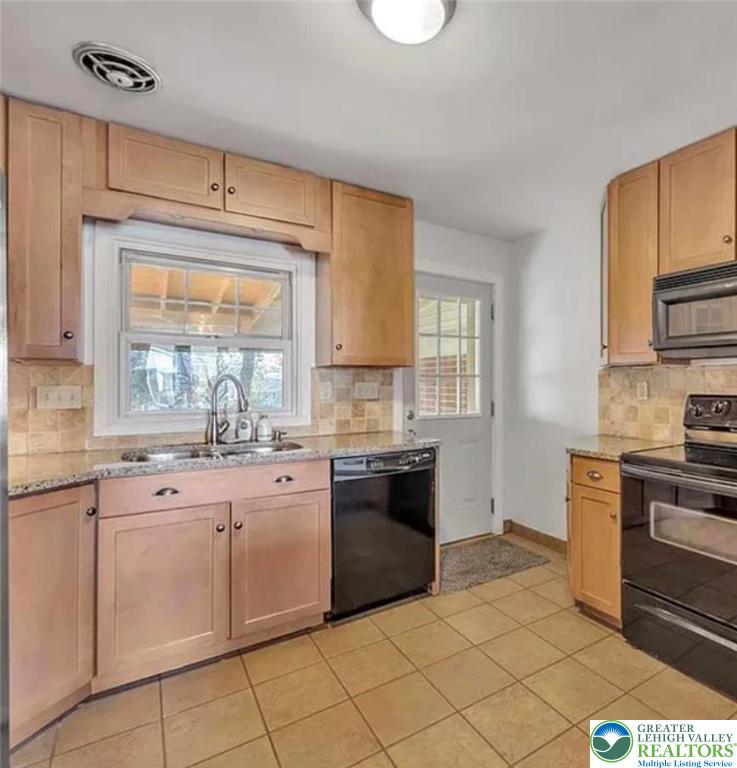 2324 Kemmerer Street Bethlehem, PA 18017 - Photo 5 of 26 a kitchen with granite countertop cabinets stainless steel appliances and a sink