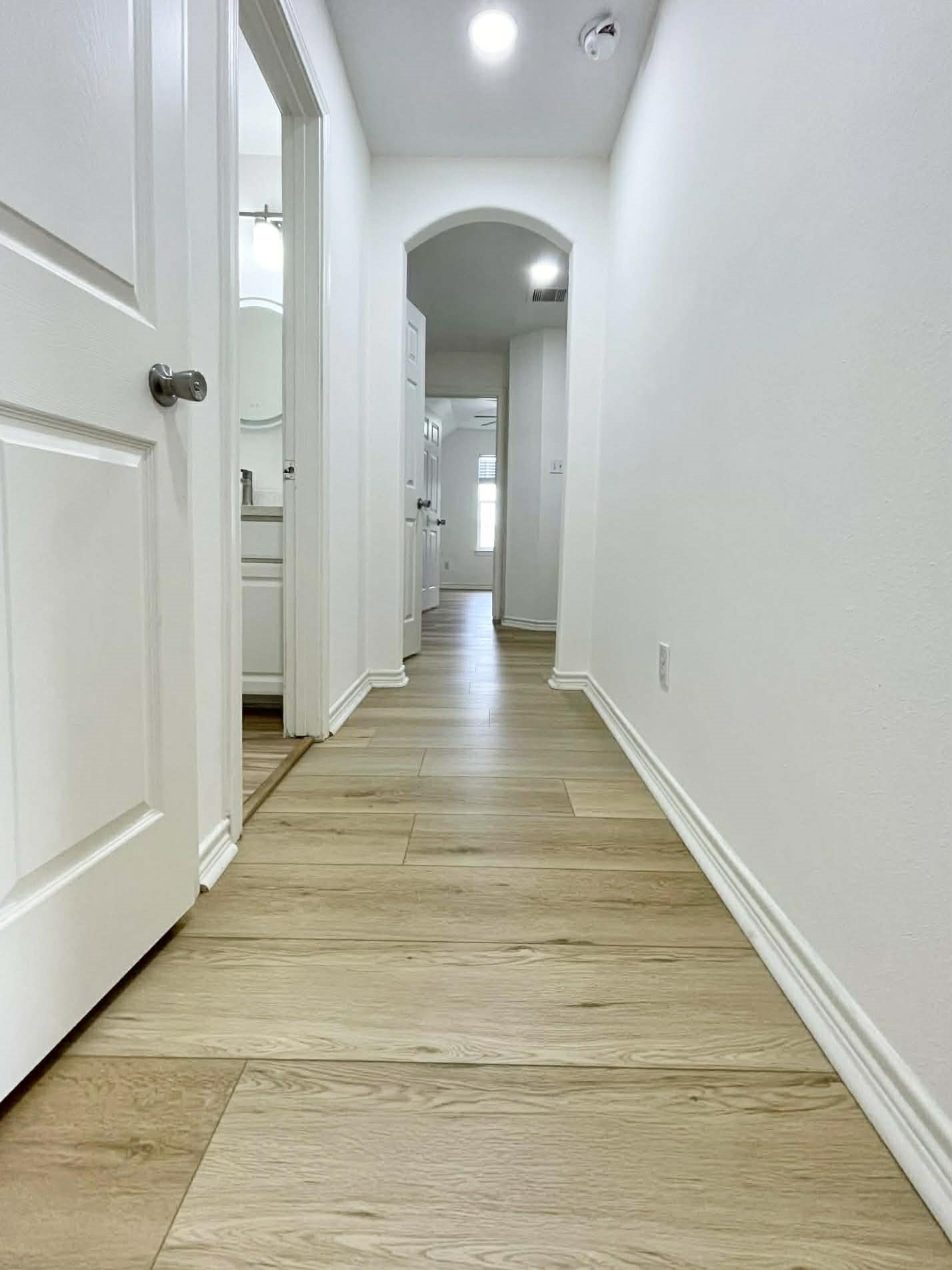 7916 Comal Street Houston, TX 77051 - Photo 16 of 21 a view of a hallway with wooden floor