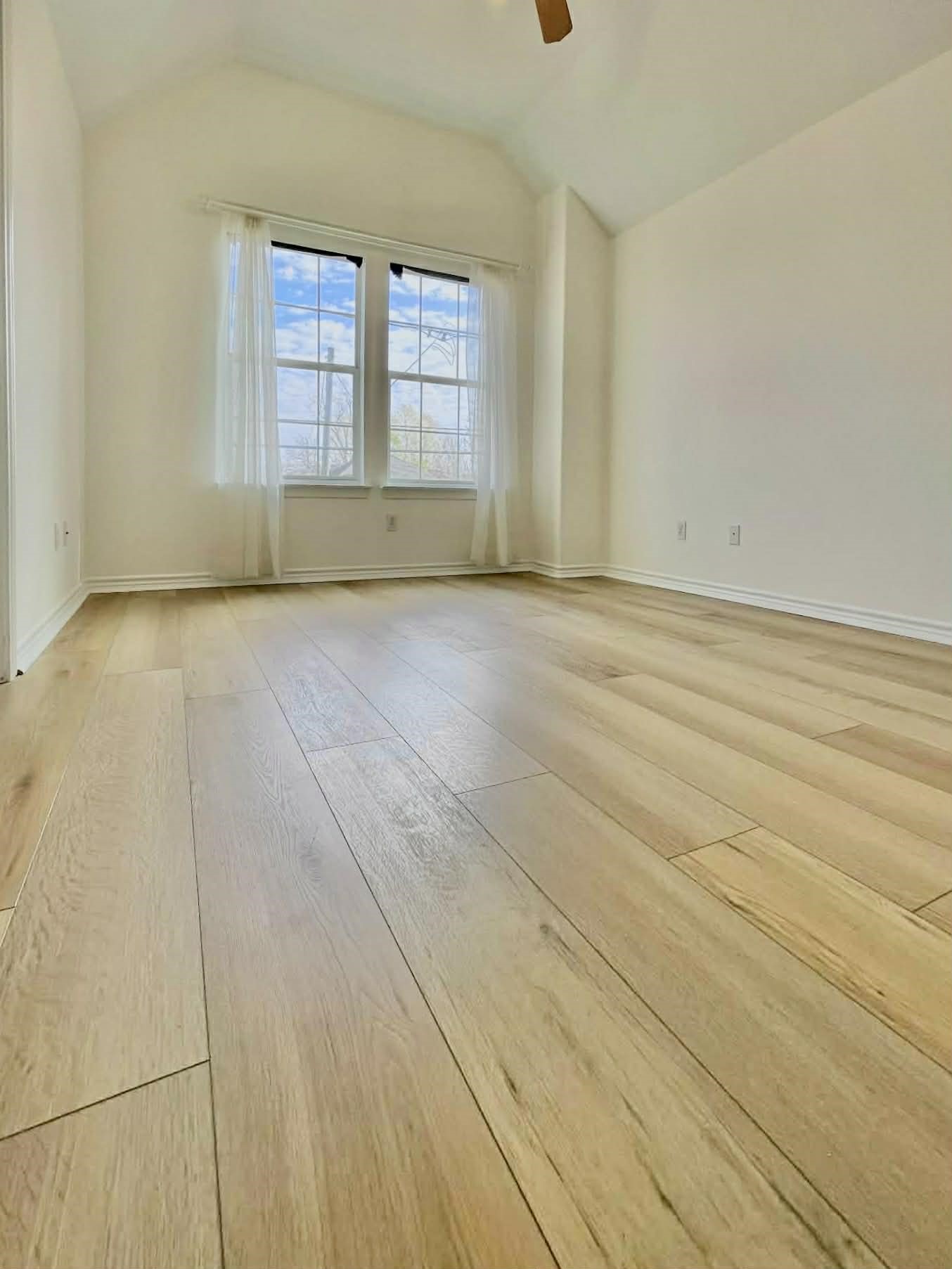 7916 Comal Street Houston, TX 77051 - Photo 19 of 21 an empty room with wooden floor and windows