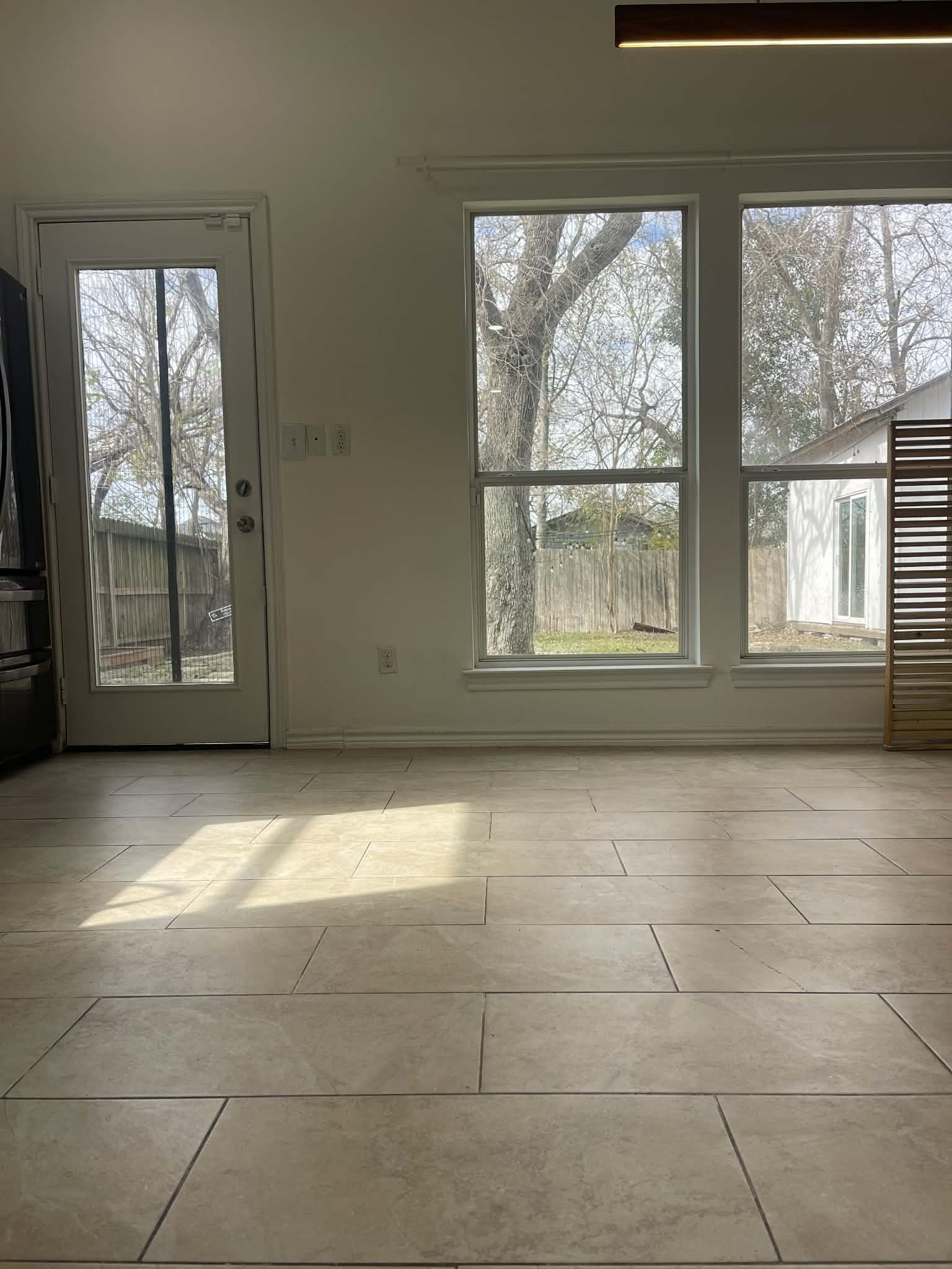 7916 Comal Street Houston, TX 77051 - Photo 5 of 21 a view of an empty room with a window