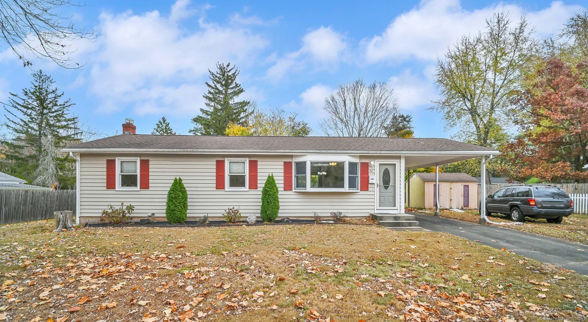 front view of a house with a yard