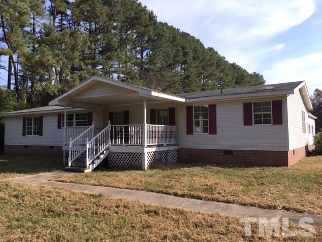 2329 Thee Hester Road Roxboro, NC 27574 - Photo 1 of 7 a front view of a house with a yard