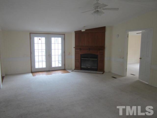 2329 Thee Hester Road Roxboro, NC 27574 - Photo 4 of 7 an empty room with a fireplace