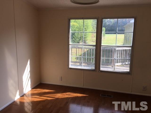 2329 Thee Hester Road Roxboro, NC 27574 - Photo 6 of 7 a view of an empty room and window