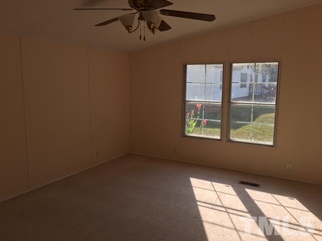 2329 Thee Hester Road Roxboro, NC 27574 - Photo 7 of 7 a view of an empty room with a window