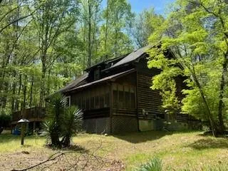 a backyard of a house with lots of green space