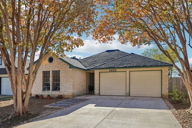 a house with trees in front of it