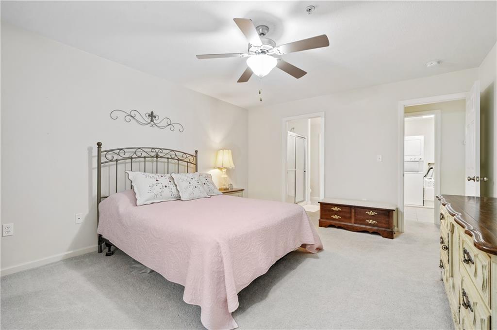 1 Coraopolis Road, Unit 303 Coraopolis, PA 15108 - Photo 12 of 22 a bedroom with a bed and a chandelier