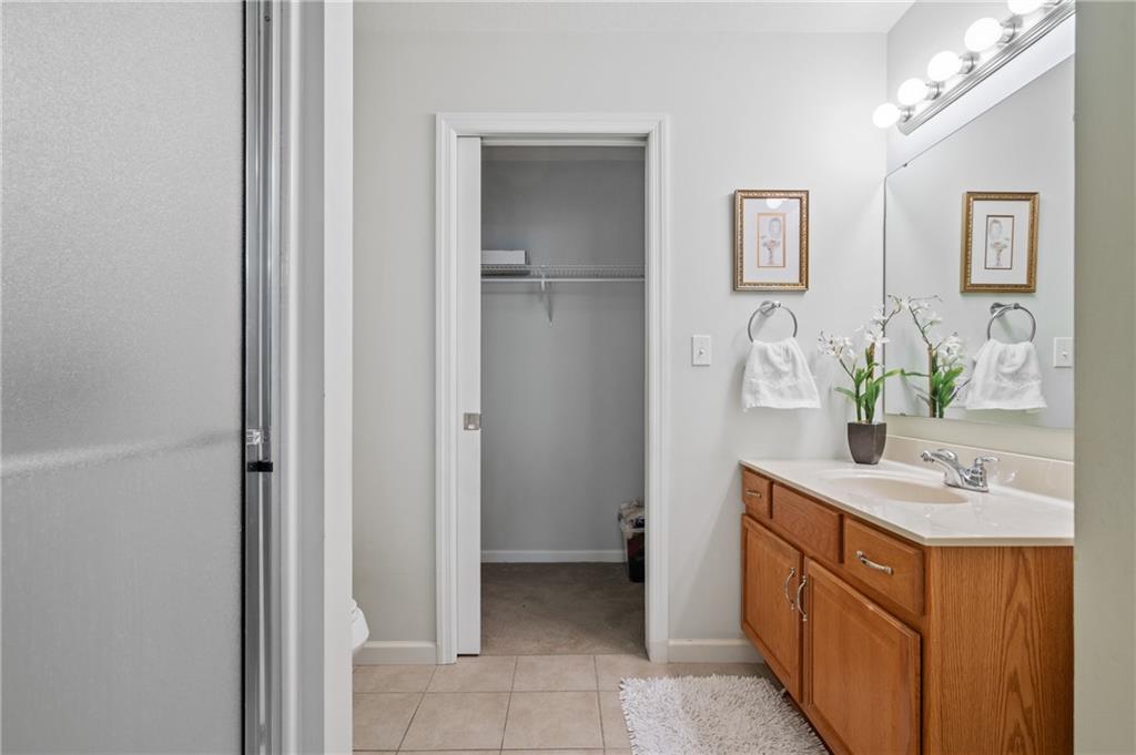 1 Coraopolis Road, Unit 303 Coraopolis, PA 15108 - Photo 13 of 22 a bathroom with a sink and a mirror