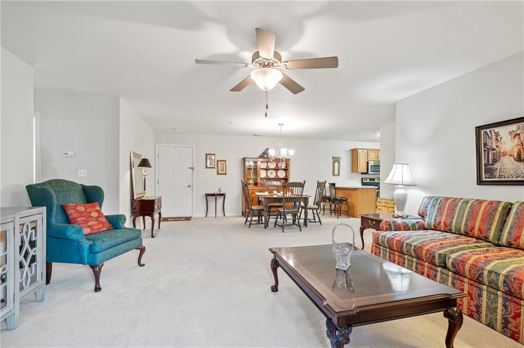 1 Coraopolis Road, Unit 303 Coraopolis, PA 15108 - Photo 10 of 22 a living room with furniture and white walls