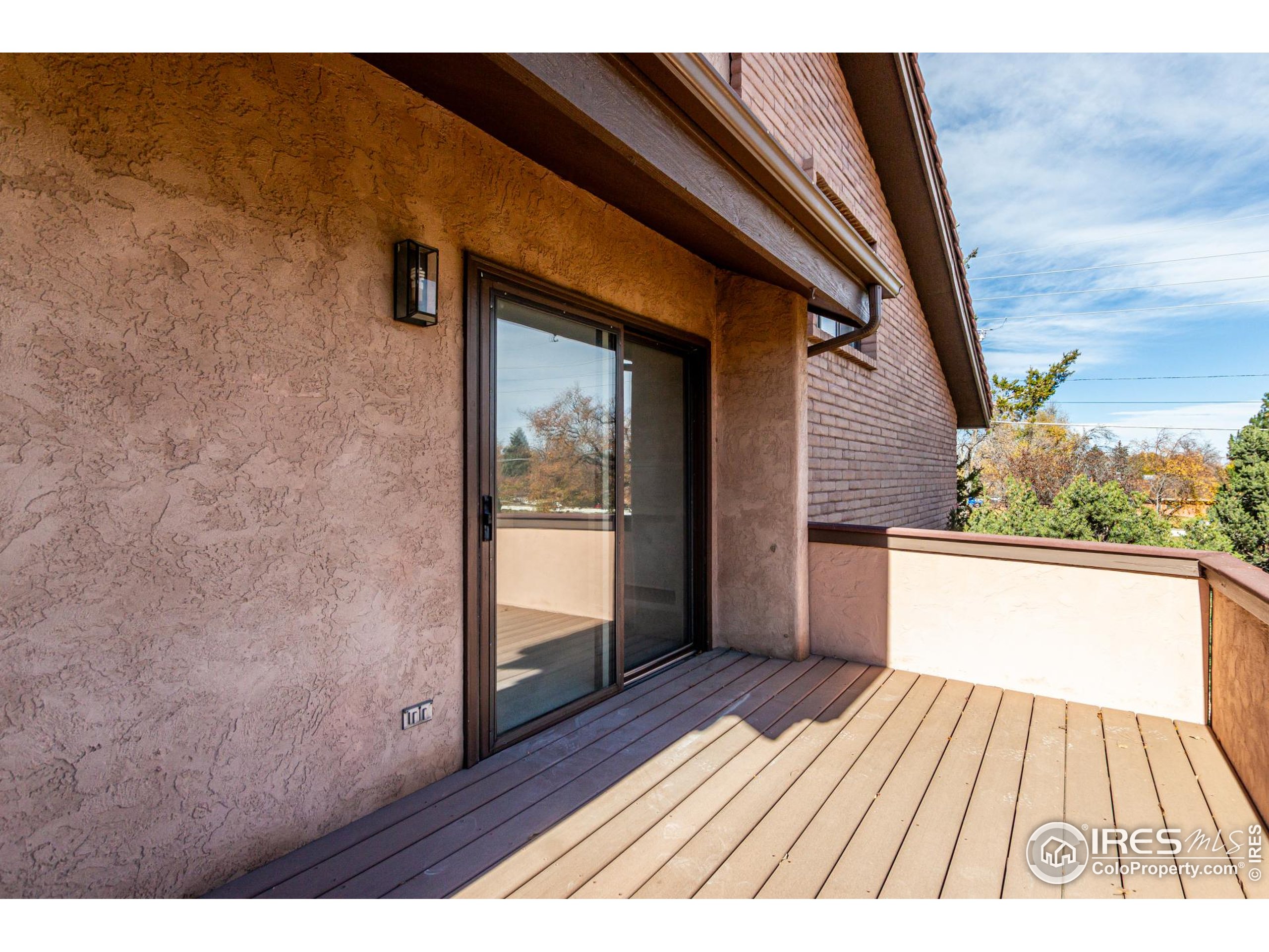 4415 Laguna Place, Unit 201 Boulder, CO 80303 - Photo 13 of 38 a view of balcony with wooden floor