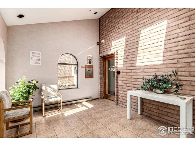 a living room with a sink and furniture