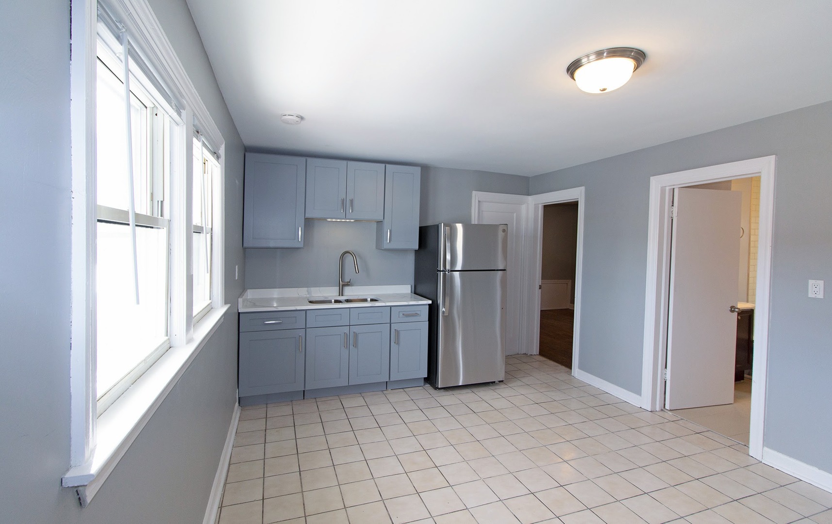 7535 West 58th Place Summit, IL 60501 - Photo 11 of 34 a kitchen with a refrigerator and a sink