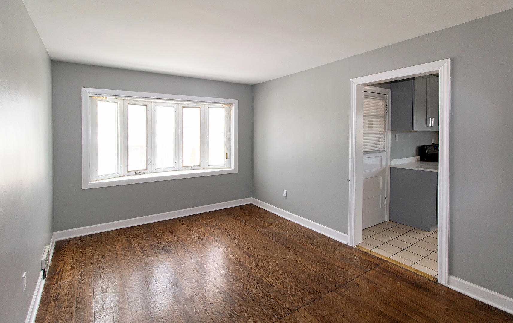 7535 West 58th Place Summit, IL 60501 - Photo 14 of 34 an empty room with wooden floor closet and windows